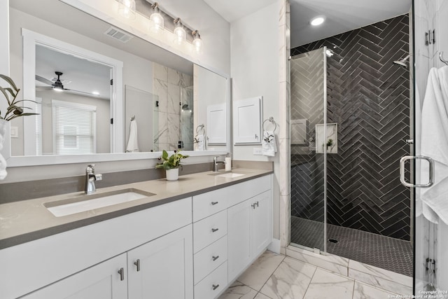 bathroom with vanity, ceiling fan, and an enclosed shower