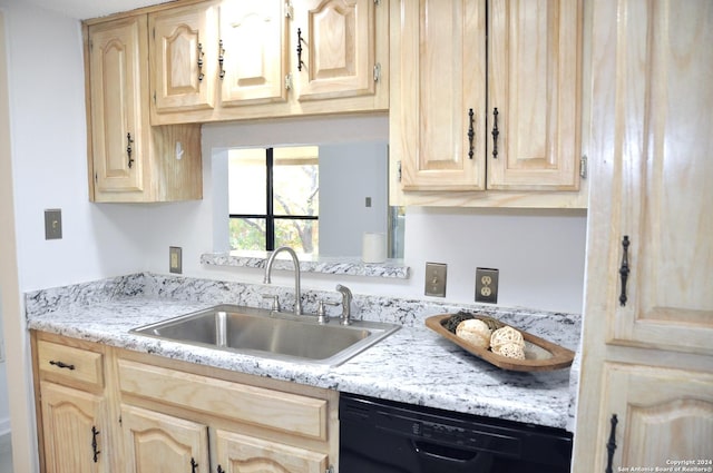 kitchen featuring dishwasher, sink, and light brown cabinetry