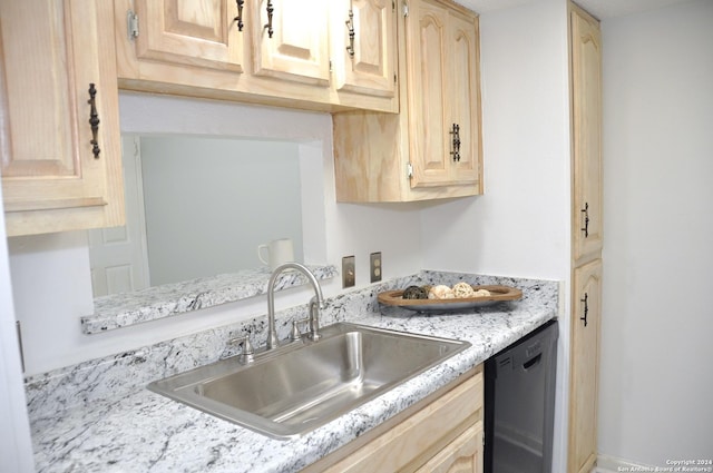 kitchen featuring dishwasher, light brown cabinets, light stone countertops, and sink