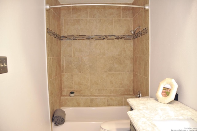 full bathroom with vanity, toilet, and tiled shower / bath