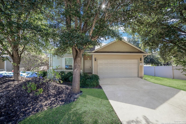 view of front of house with a porch, a garage, and a front lawn