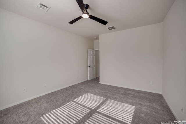 carpeted empty room with ceiling fan