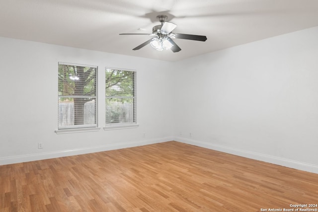 spare room with ceiling fan and light hardwood / wood-style floors