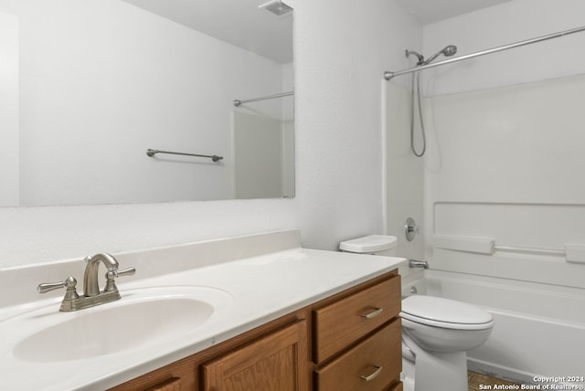 full bathroom with vanity, toilet, and washtub / shower combination