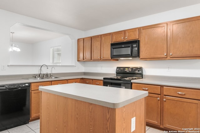 kitchen featuring black appliances, sink, light tile patterned floors, a kitchen island, and a chandelier