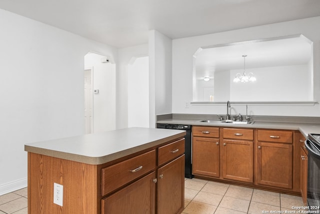 kitchen featuring sink, black appliances, pendant lighting, an inviting chandelier, and a center island