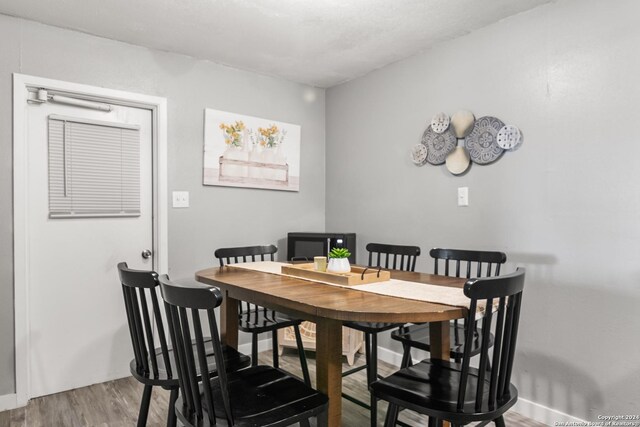 dining area featuring hardwood / wood-style floors