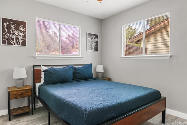 bedroom with wood-type flooring