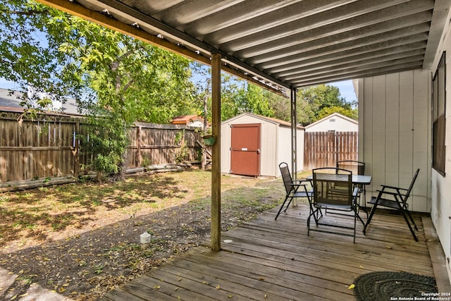 wooden deck featuring a shed