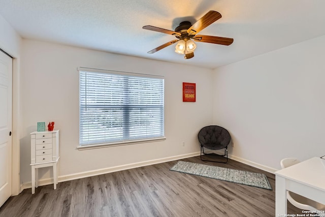 unfurnished room featuring ceiling fan and hardwood / wood-style floors