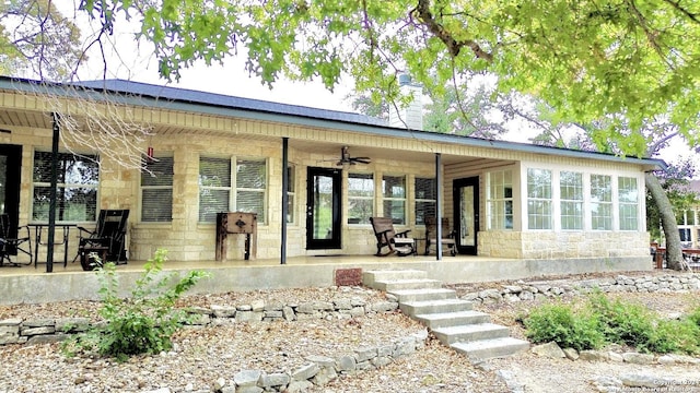 back of house featuring ceiling fan and a patio area