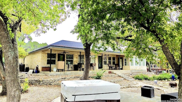 rear view of house with a patio, central AC unit, and ceiling fan