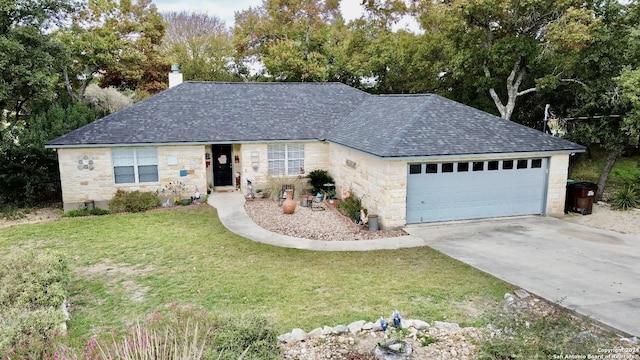 single story home with a garage and a front lawn