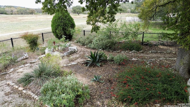 view of yard with a rural view