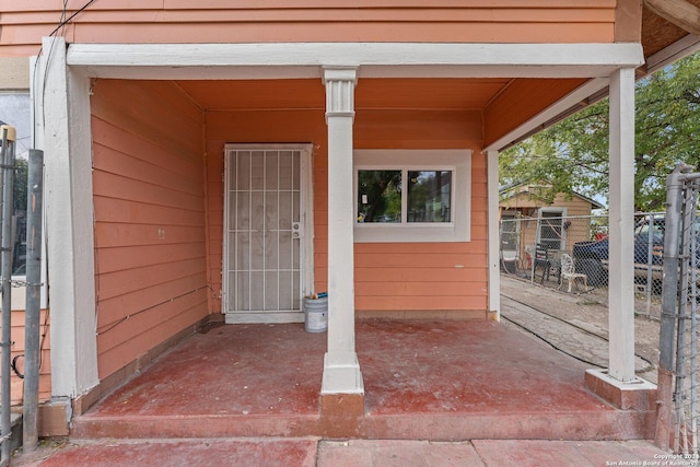 property entrance featuring a patio area