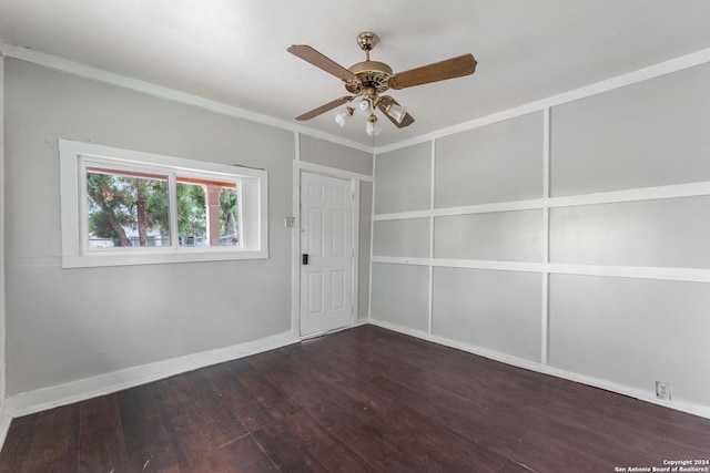 empty room with ceiling fan and dark wood-type flooring