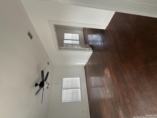 unfurnished room with dark hardwood / wood-style flooring