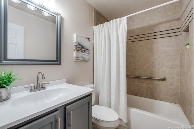 full bathroom with shower / tub combo, vanity, and toilet