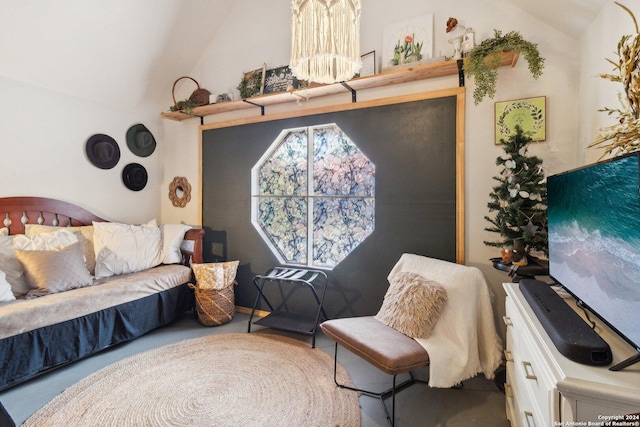 living area featuring a chandelier and lofted ceiling