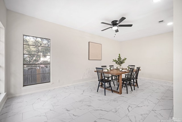 dining space with ceiling fan