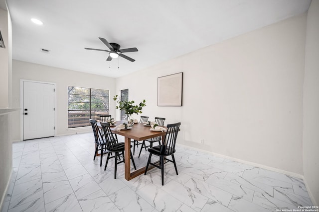 dining room featuring ceiling fan