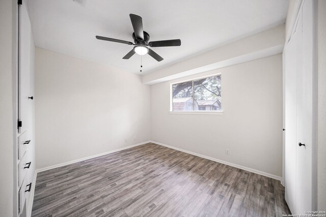 unfurnished room featuring hardwood / wood-style flooring and ceiling fan