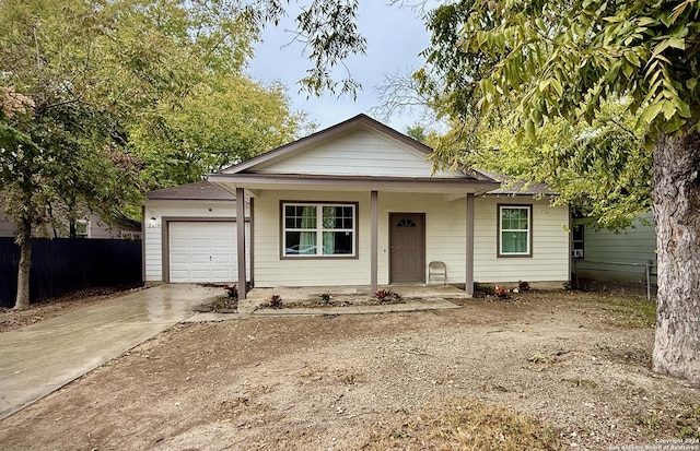 view of front of house with a garage and covered porch