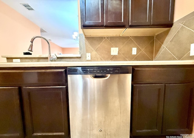 kitchen with backsplash, stainless steel dishwasher, dark brown cabinetry, and sink