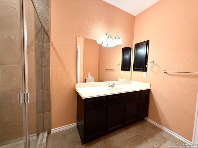 bathroom with vanity, tile patterned floors, and an enclosed shower