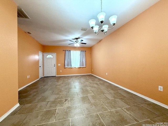 interior space featuring ceiling fan with notable chandelier