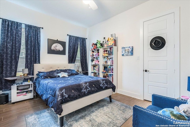 bedroom with ceiling fan and wood-type flooring