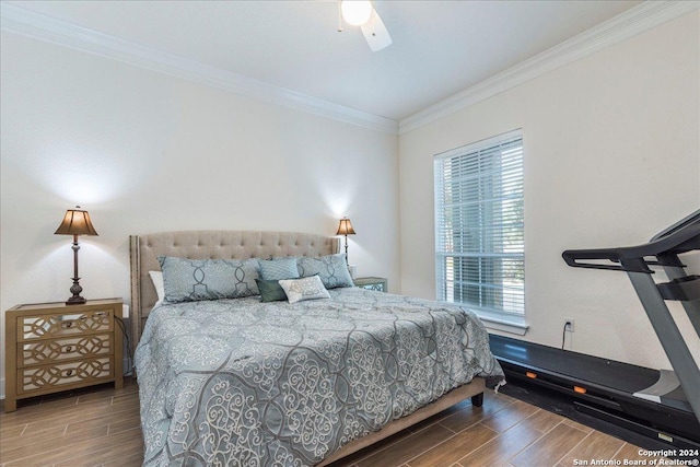 bedroom with hardwood / wood-style flooring, ceiling fan, and ornamental molding