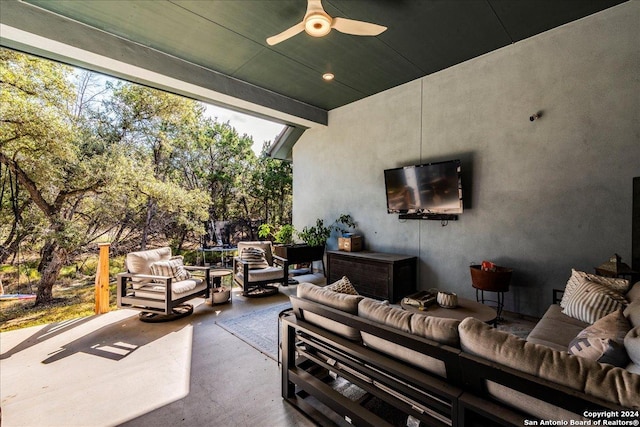 view of patio / terrace featuring ceiling fan, an outdoor hangout area, and a trampoline