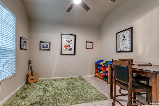 office area with light tile patterned floors, vaulted ceiling, plenty of natural light, and ceiling fan