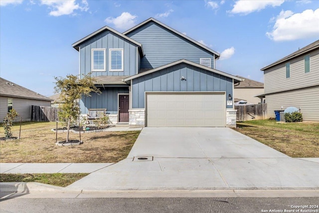 view of front facade with a garage and a front yard