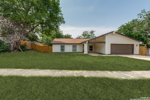 ranch-style house with a garage and a front yard