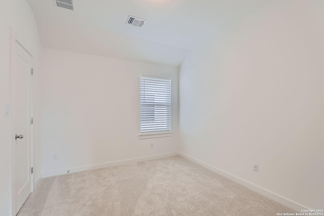 empty room with light colored carpet