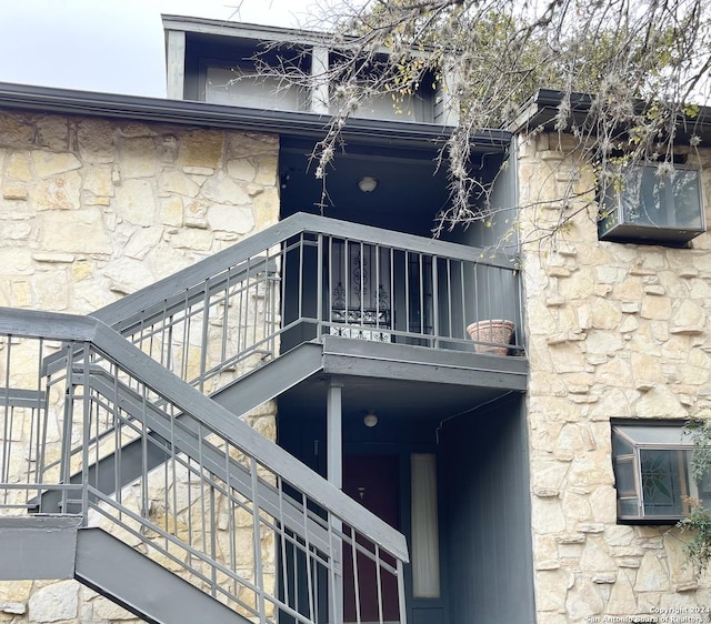 rear view of house featuring a balcony