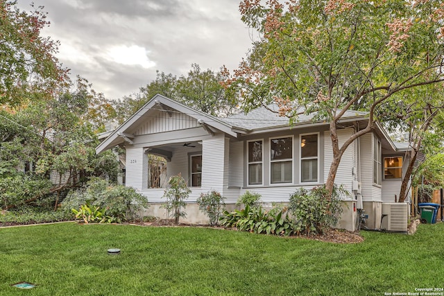 338 Queen Anne, San Antonio, TX 78209 - view of front facade featuring cooling unit and a front lawn