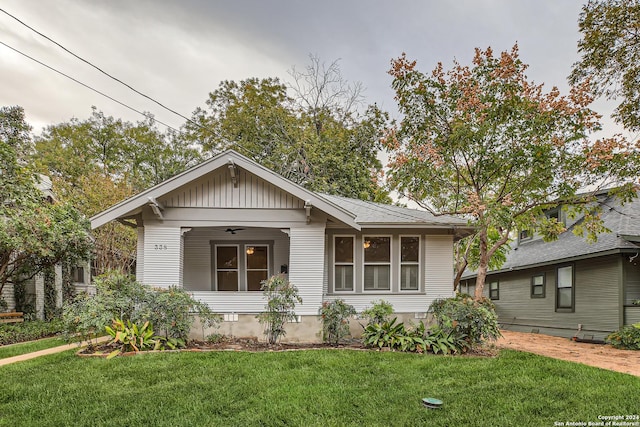338 Queen Anne, San Antonio, TX 78209 - view of front of house featuring a front lawn, ceiling fan, and board and batten siding