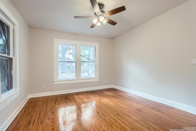 empty room featuring ceiling fan and hardwood / wood-style flooring