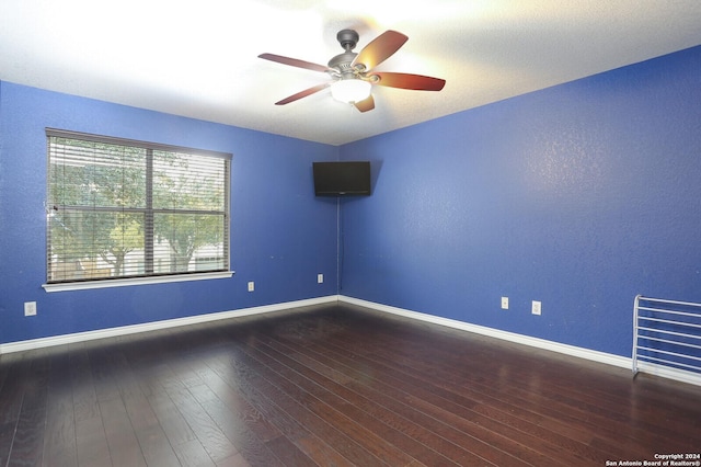 spare room featuring ceiling fan and hardwood / wood-style flooring