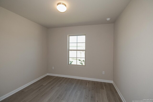 empty room featuring hardwood / wood-style flooring