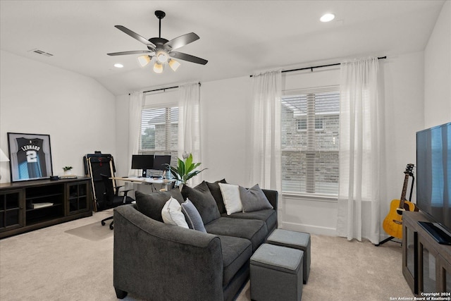 carpeted living room with vaulted ceiling and ceiling fan