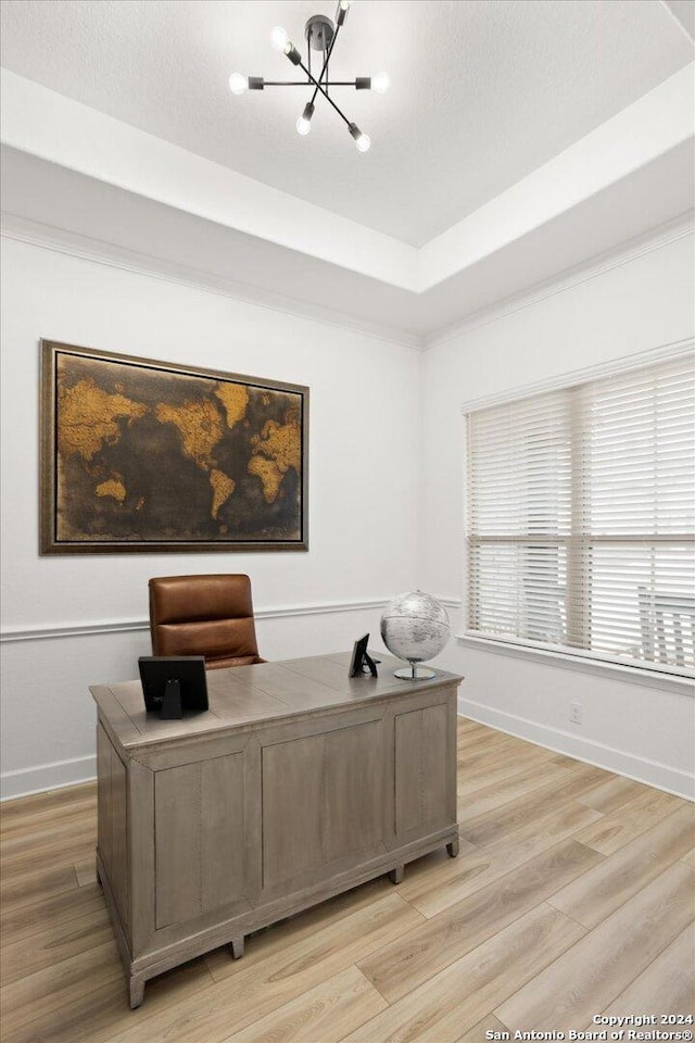 office space with a chandelier and light hardwood / wood-style floors