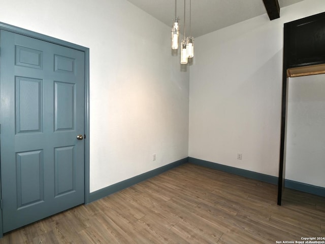 spare room with wood-type flooring