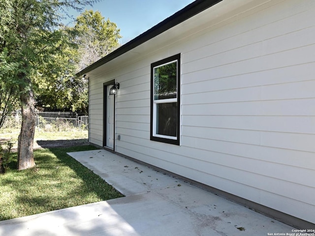 view of home's exterior with a yard