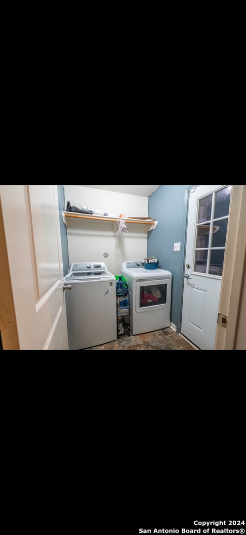 washroom featuring washing machine and dryer