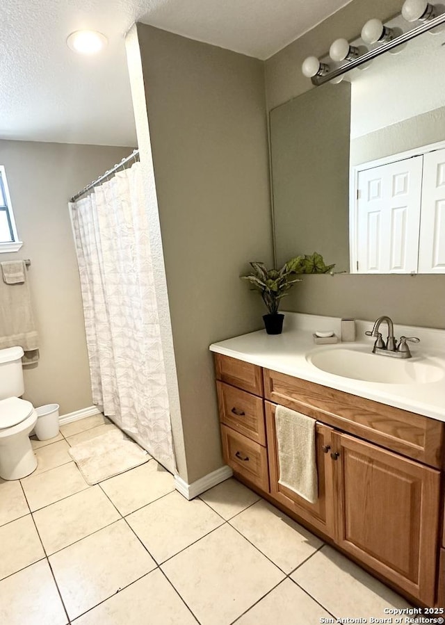 221 Chaparral St, Uvalde, TX 78801 - bathroom featuring vanity, tile patterned flooring, and a shower with shower curtain