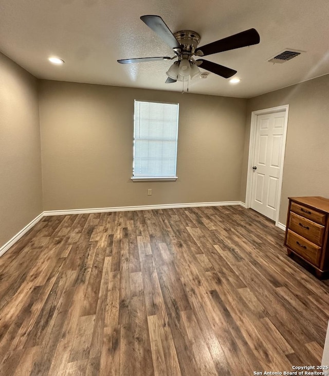 221 Chaparral St, Uvalde, TX 78801 - spare room with ceiling fan, dark wood-style floors, and recessed lighting